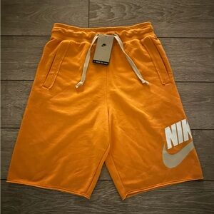 Nike Sportswear Essentials Alumni Shorts, Men’s size XS or Youth XL Orange/Tan